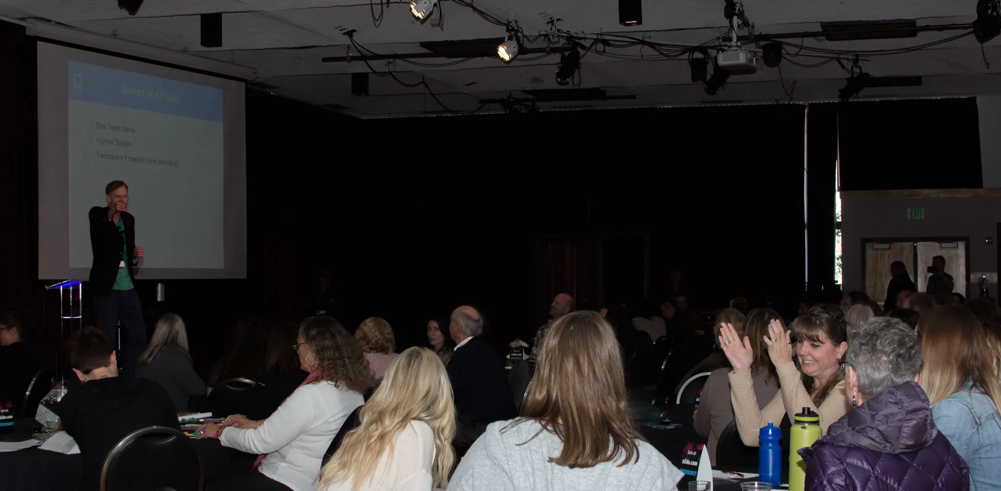 Attendees playing Quizzify live during a health-education game session