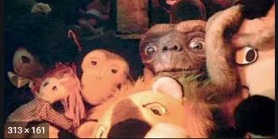 Grainy video still of stuffed-animal puppets crowded together
