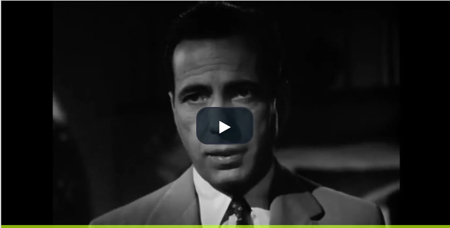 Video thumbnail: a black-and-white film clip of a man in a suit speaking directly to the camera