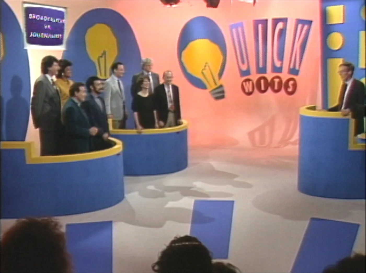 The set of the Boston quiz show Quick Wits on WLVI, contestants ranged along their podiums and the host at the right.